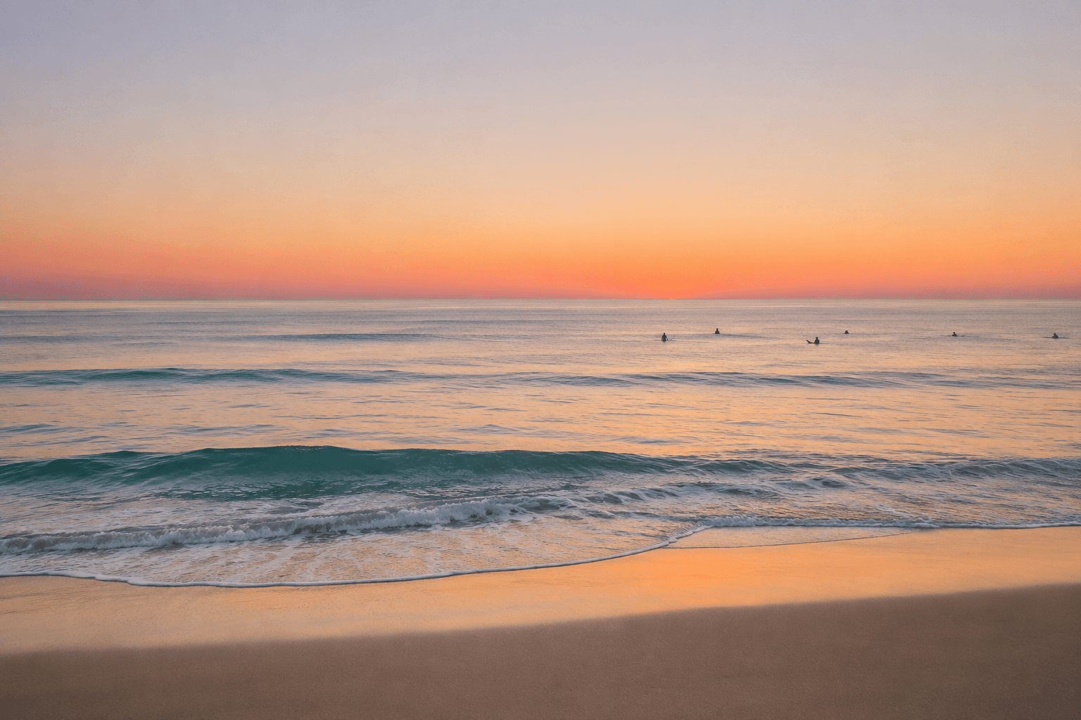 A calm pastel ocean at first light